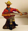 Durso Cowboy sitzend mit Gitarre